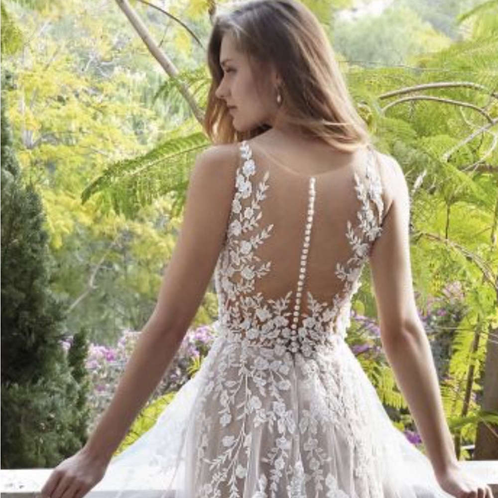 Demetrios brand new. 
Style 1176 is a beautifully crafted gown